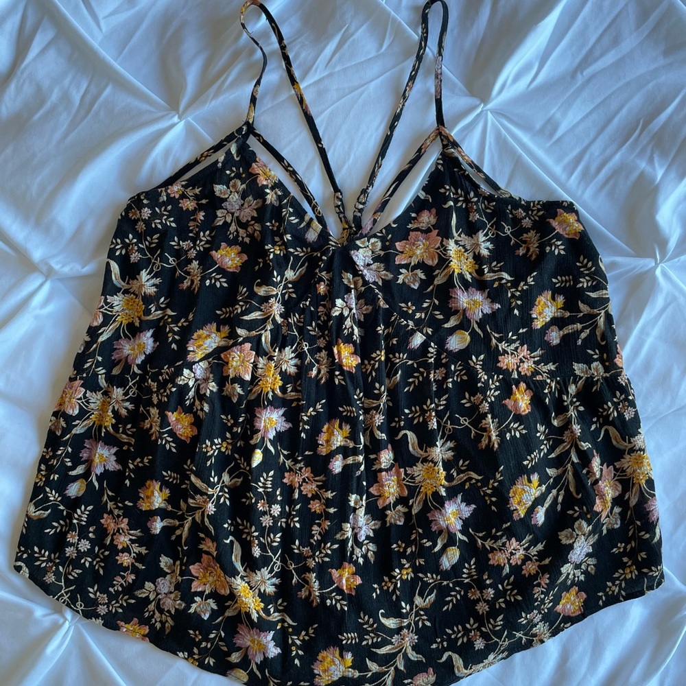 Flowy tank with floral pattern and detailed straps. From American Eagle.